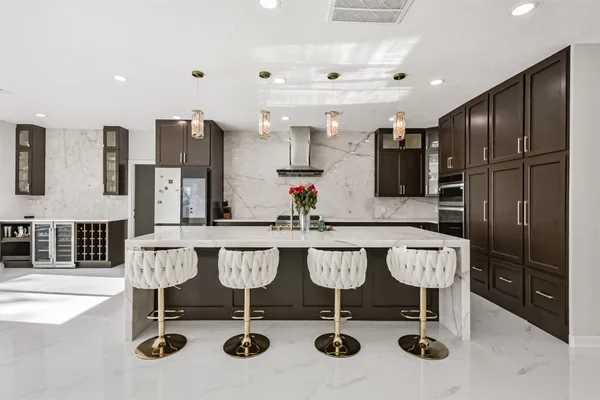 a view of kitchen with dining area and stainless steel appliances