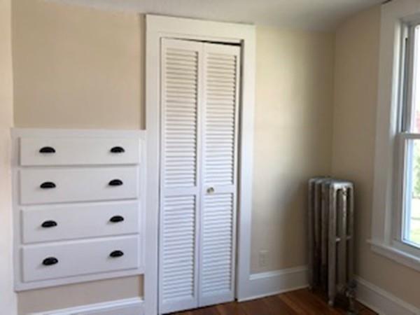 42 Carroll Street Springfield, MA 01108 - Photo 12 of 16 a view of a closet area with bedroom
