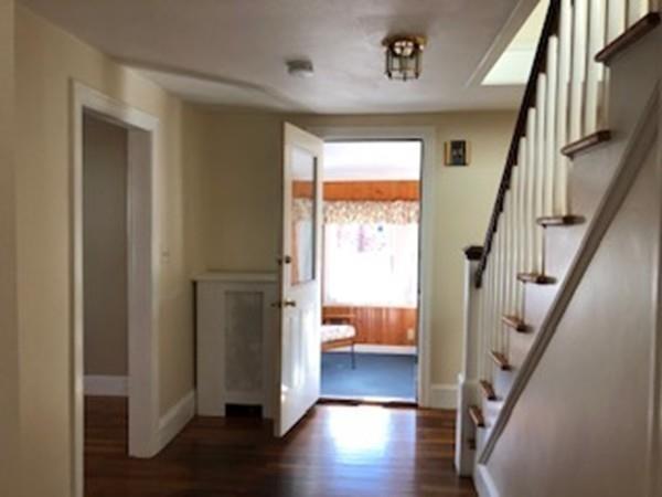 42 Carroll Street Springfield, MA 01108 - Photo 13 of 16 a view of entryway with wooden floor and stairs