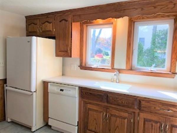 42 Carroll Street Springfield, MA 01108 - Photo 3 of 16 a kitchen with a refrigerator and a sink