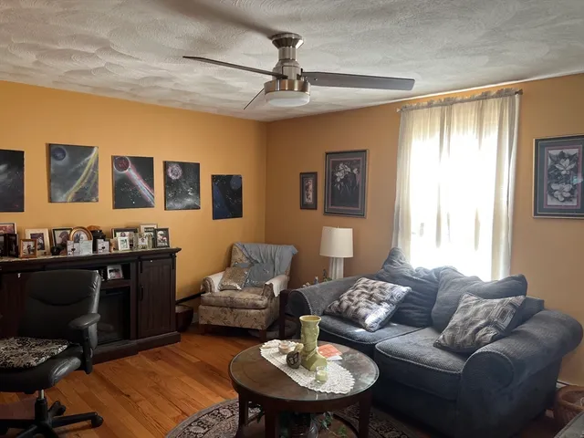 a living room with furniture and a table