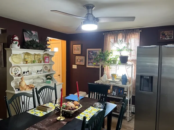 a view of a dining room with furniture window and outside view