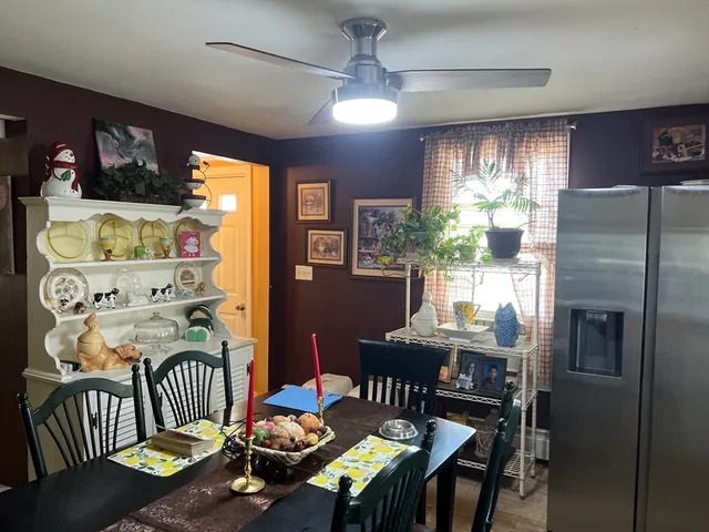 a view of a dining room with furniture window and outside view
