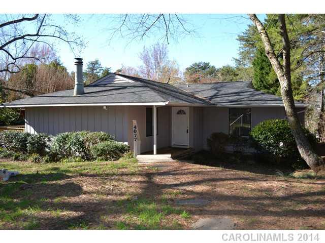 4077 Point Clear Drive Tega Cay, SC 29708 - Photo 1 of 14 a front view of a house with garden