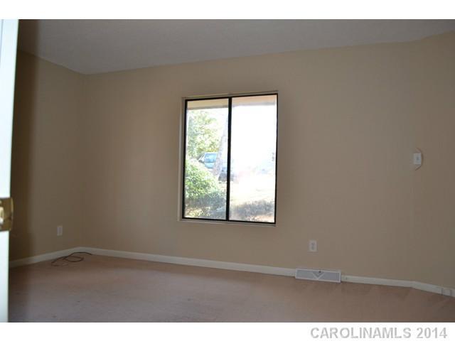 4077 Point Clear Drive Tega Cay, SC 29708 - Photo 12 of 14 a view of an empty room with a window