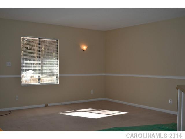 4077 Point Clear Drive Tega Cay, SC 29708 - Photo 5 of 14 a view of an empty room and a window