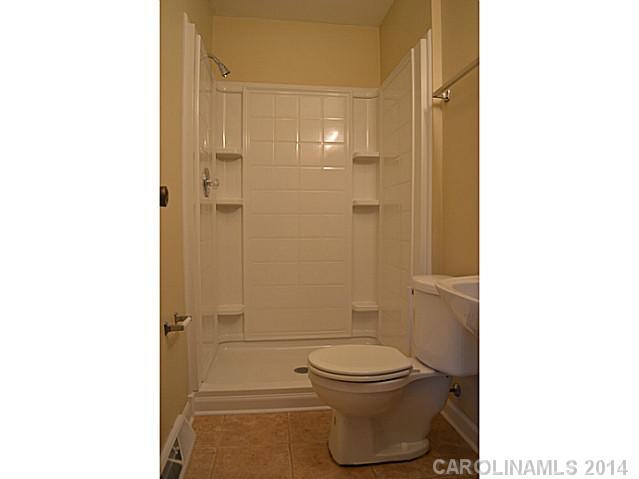 4077 Point Clear Drive Tega Cay, SC 29708 - Photo 7 of 14 a bathroom with a toilet and a shower