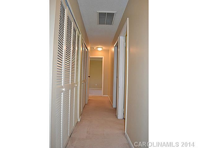 4077 Point Clear Drive Tega Cay, SC 29708 - Photo 8 of 14 a view of a hallway with closet