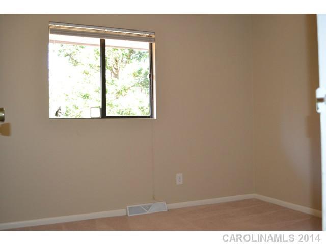 4077 Point Clear Drive Tega Cay, SC 29708 - Photo 9 of 14 an empty room with a window