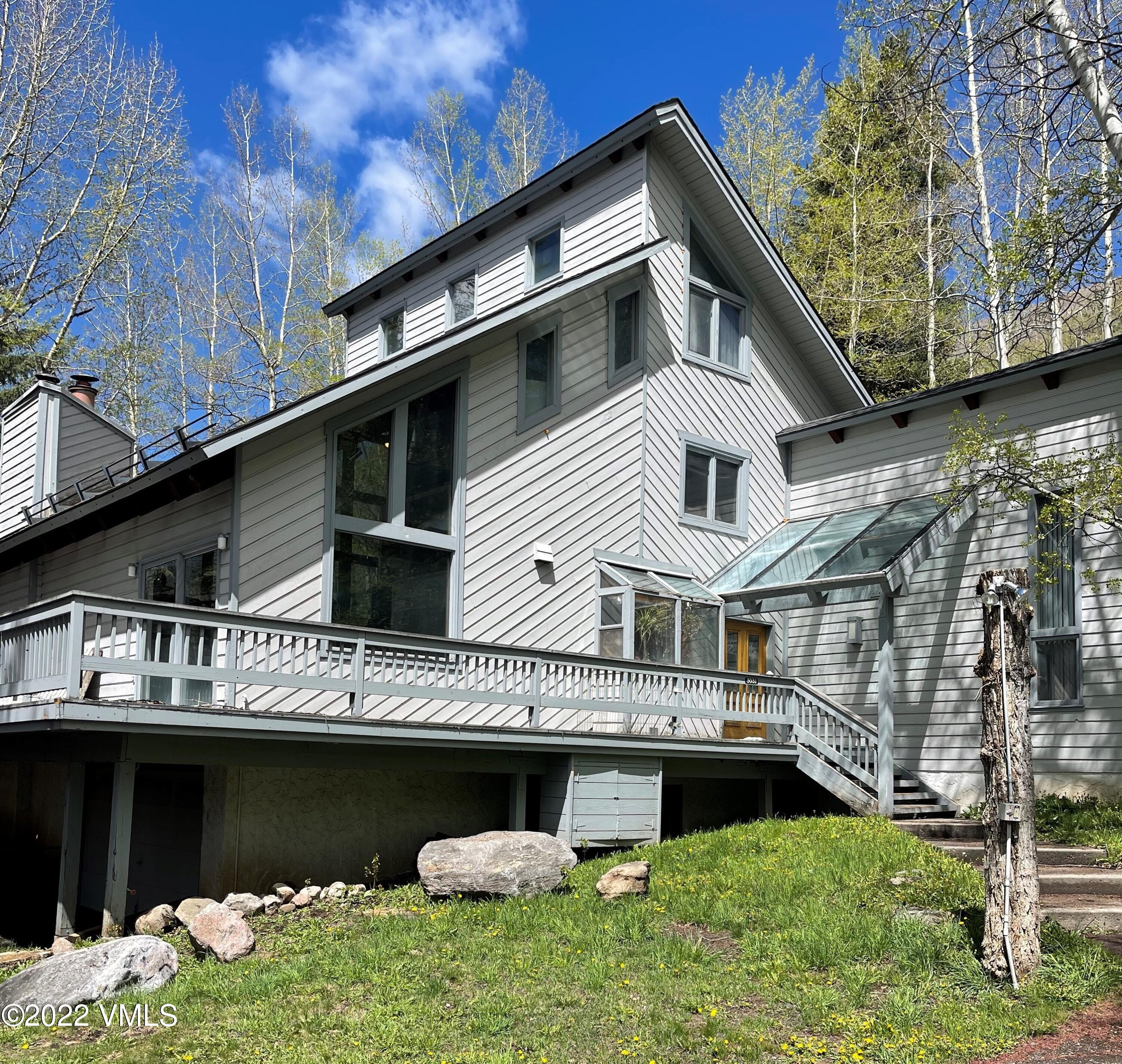 3031 Booth Falls Road Vail, CO 81657 - Photo 11 of 14 a front view of a house with a yard