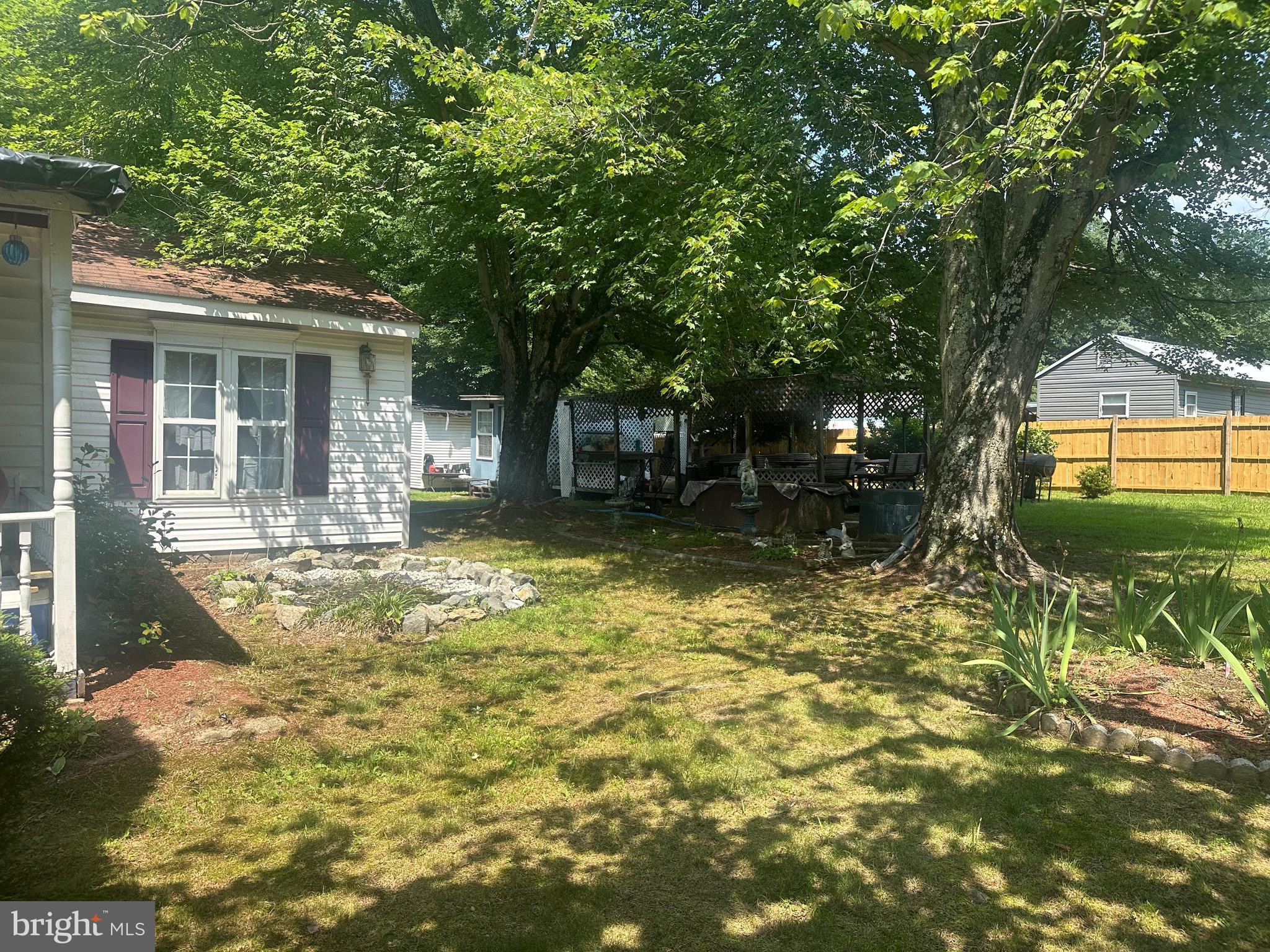 3310 Stump Neck Road Indian Head, MD 20640 - Photo 2 of 4 a view of a house with a yard balcony and tree