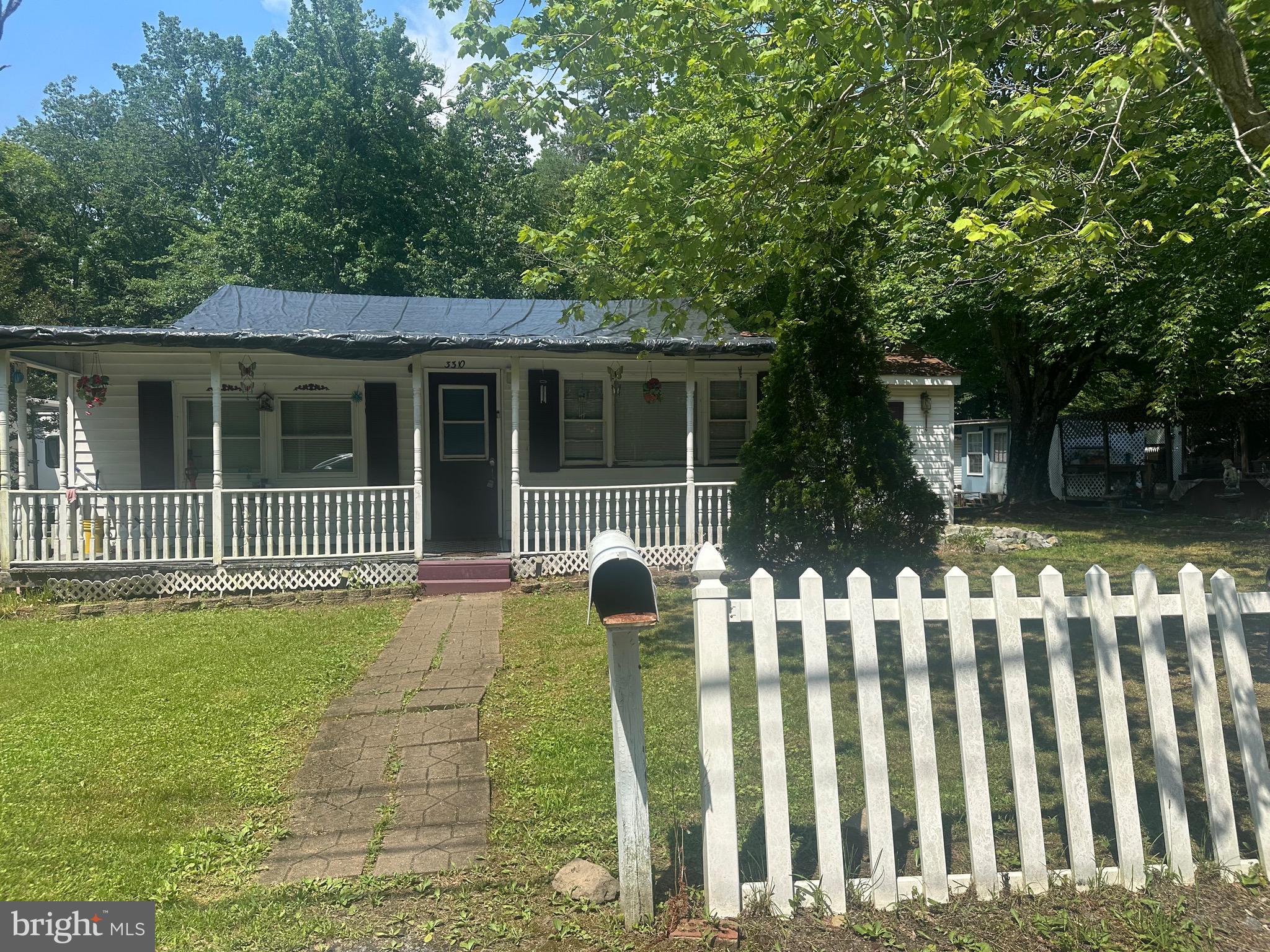 3310 Stump Neck Road Indian Head, MD 20640 - Photo 4 of 4 a front view of a house with a garden