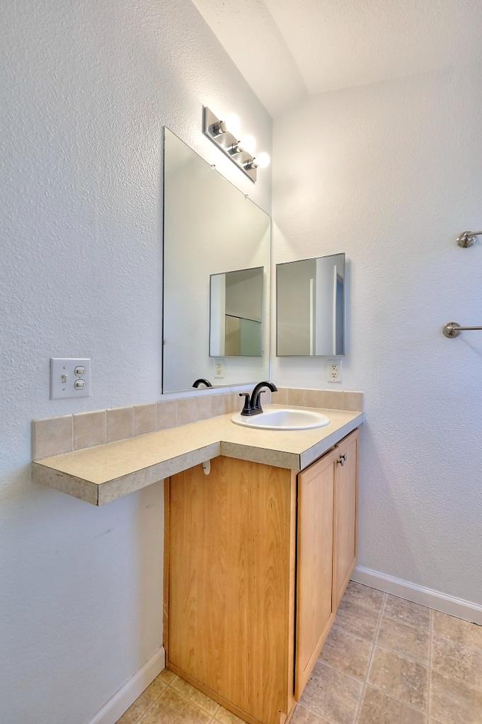 3506 Homestead Way Ceres, CA 95307 - Photo 22 of 39 a bathroom with a sink and a mirror