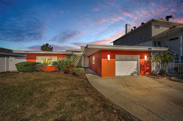 a view of a house with garage and a garage