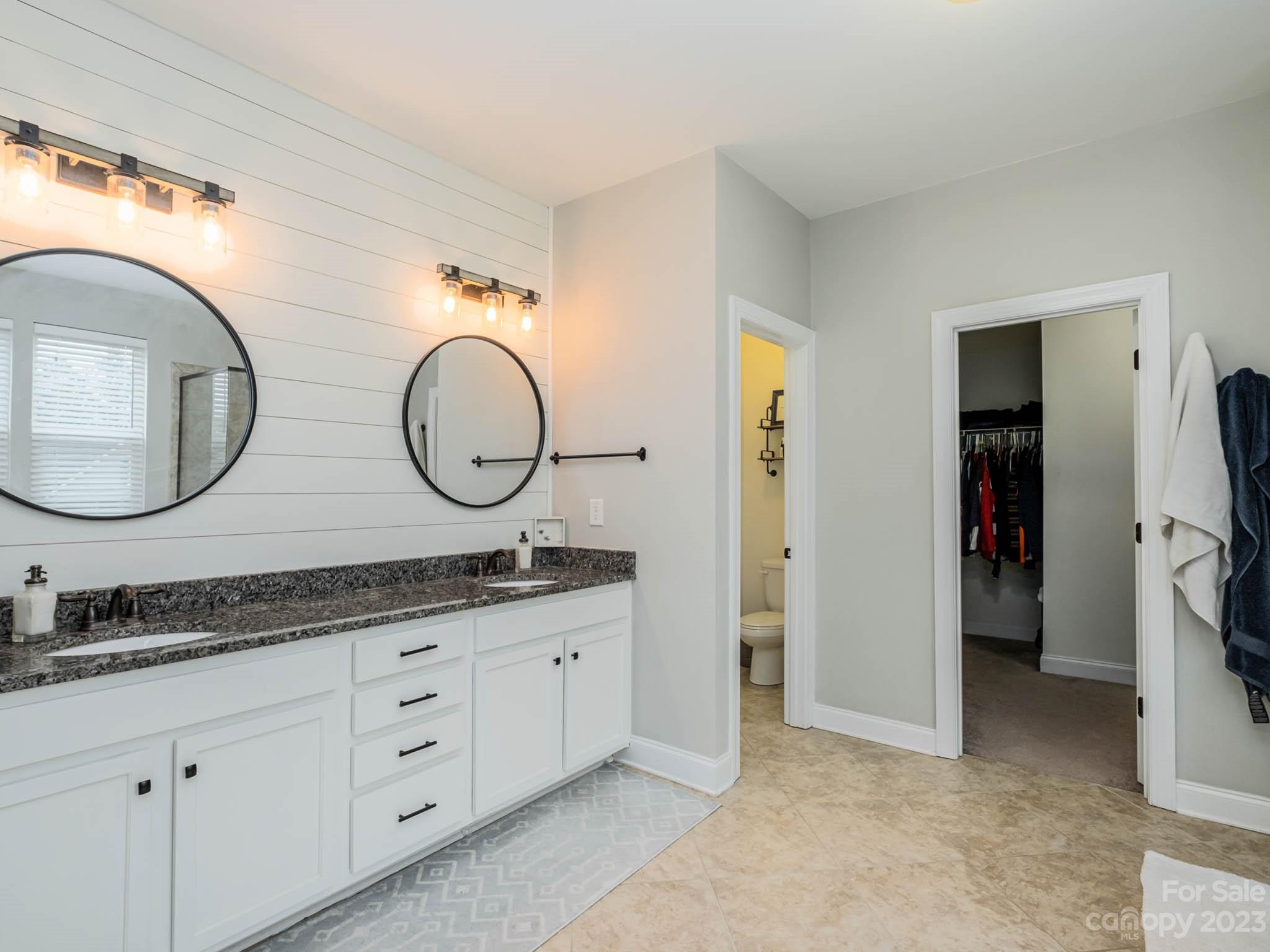 79432 Ridgehaven Road Lancaster, SC 29720 - Photo 24 of 42 a bathroom with a granite countertop sink and a mirror