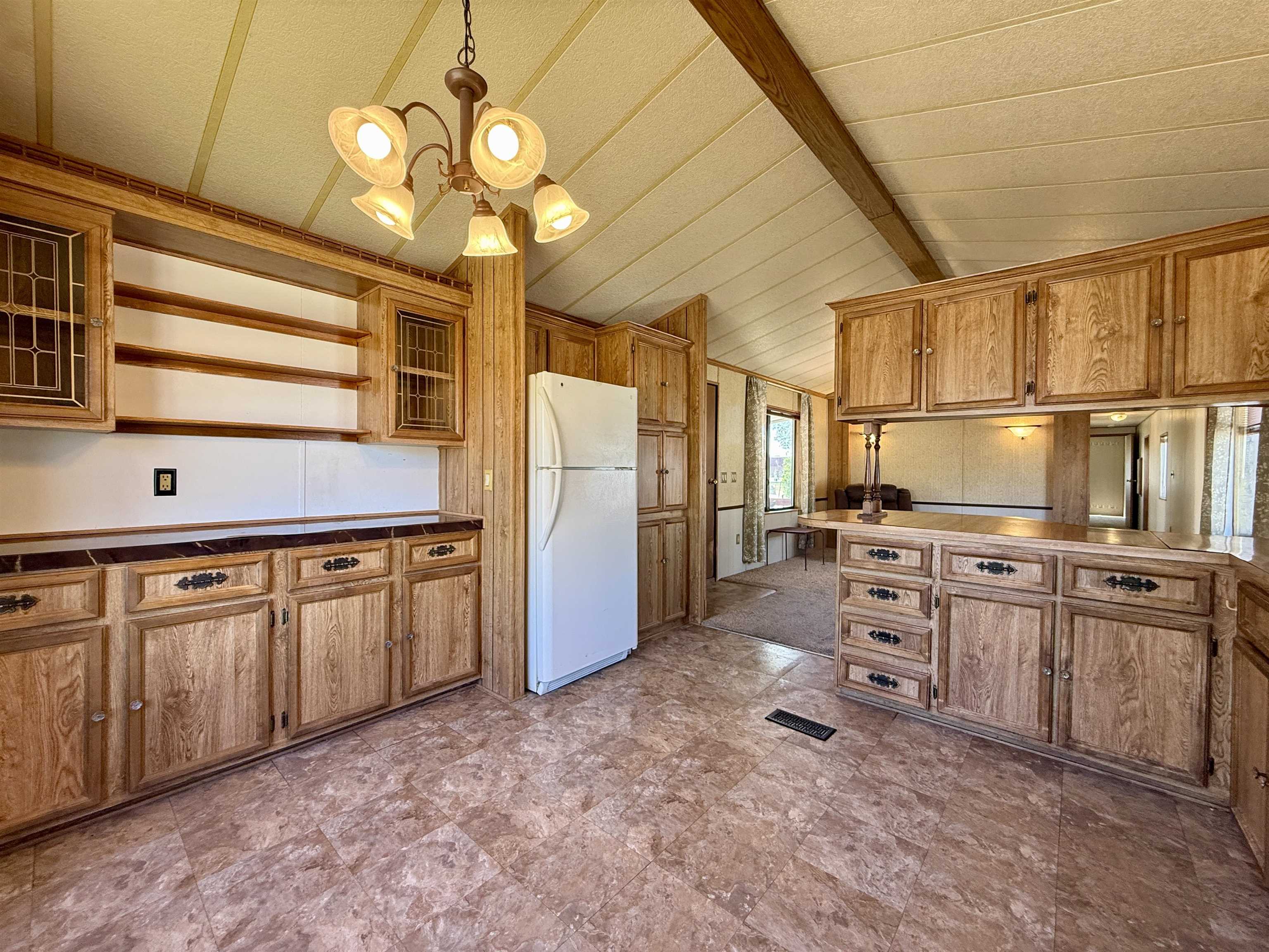 3251 E Road, Unit 33 Clifton, CO 81520 - Photo 8 of 28 a kitchen with stainless steel appliances granite countertop a stove a refrigerator and a sink