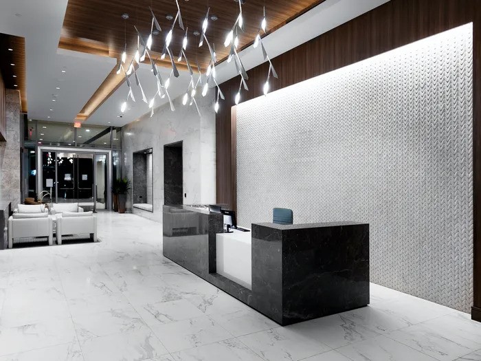 2651 Kipling Street, Unit 4004 Houston, TX 77098 - Photo 3 of 9 a lobby with furniture and chandelier