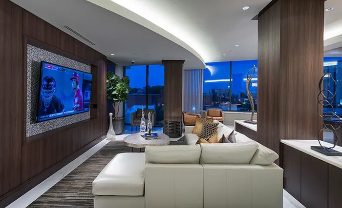 2651 Kipling Street, Unit 4004 Houston, TX 77098 - Photo 4 of 9 a living room with furniture and a fireplace