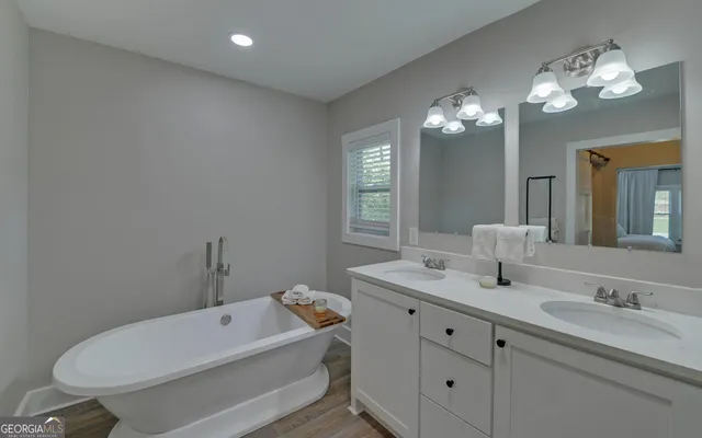 a bathroom with a double vanity sink and a mirror