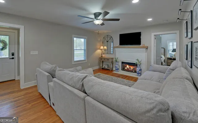 a living room with furniture and a fireplace