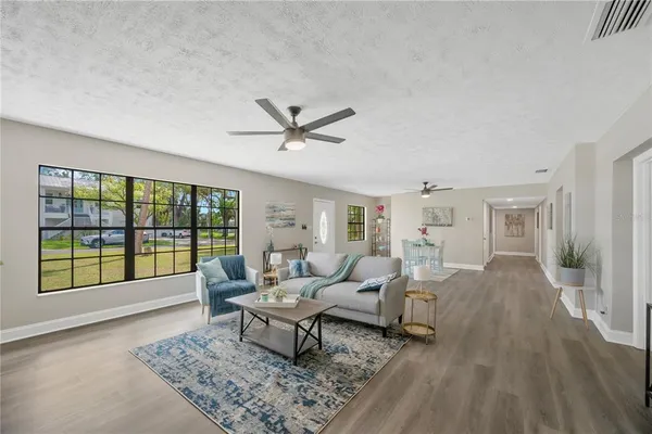 a living room with furniture and a large window