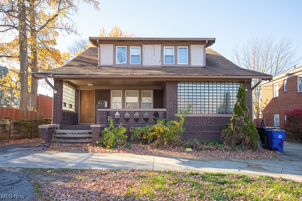 View of front of house with central AC and covered porch