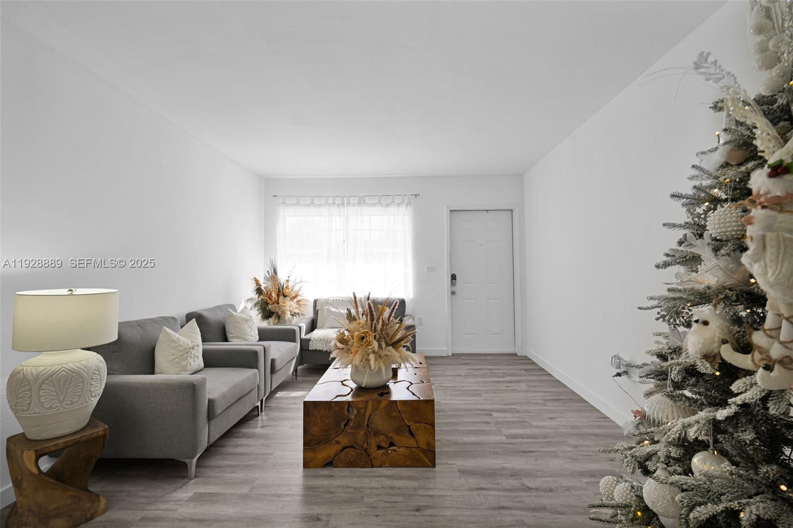 3711 Southwest 27th Terrace Miami, FL 33134 - Photo 16 of 62 a living room with furniture and a potted plant