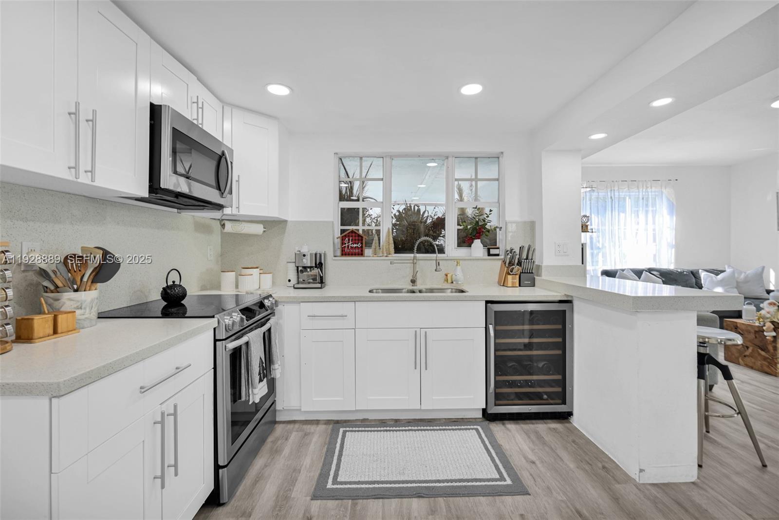 3711 Southwest 27th Terrace Miami, FL 33134 - Photo 23 of 62 a kitchen with a sink stove and cabinets