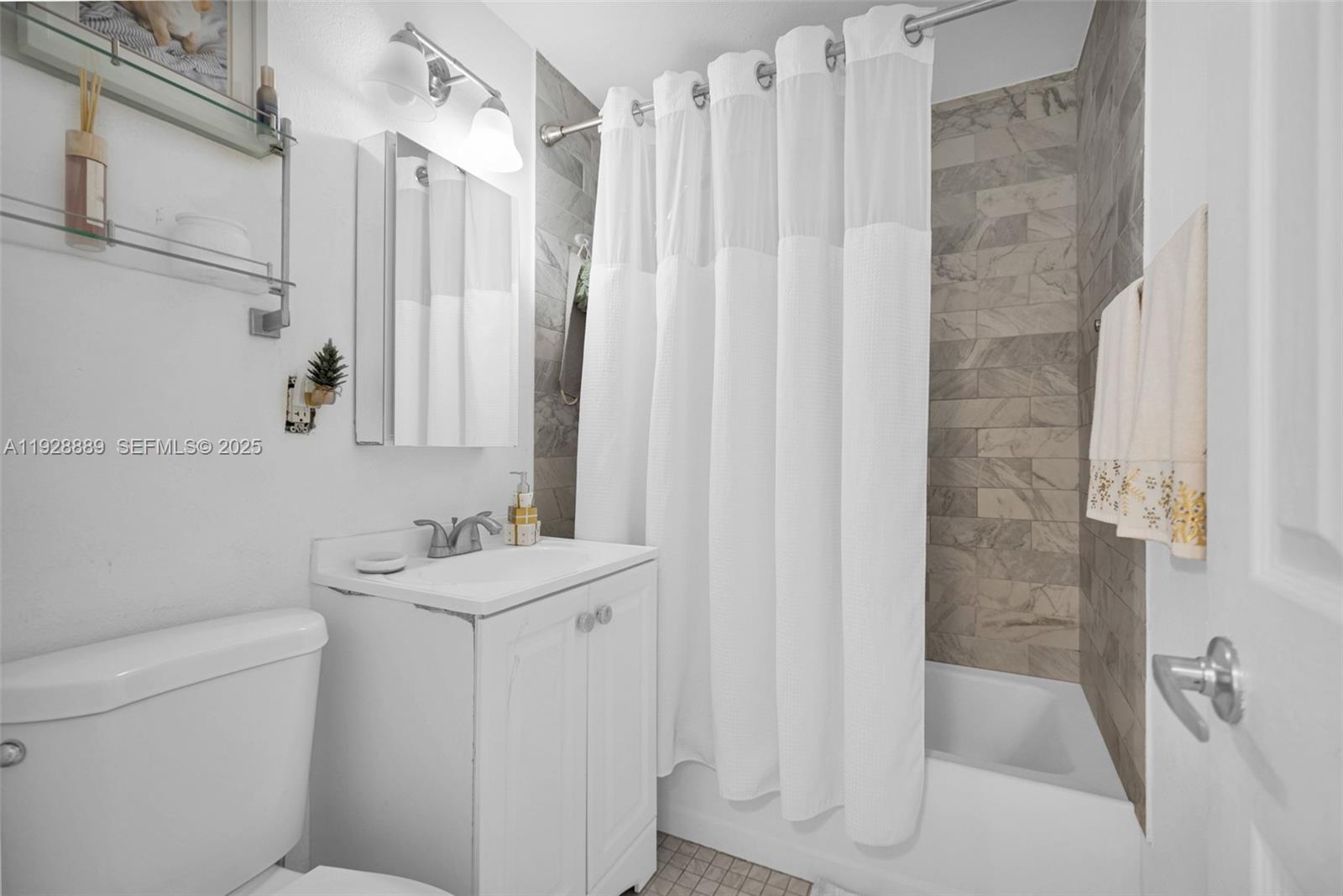 3711 Southwest 27th Terrace Miami, FL 33134 - Photo 26 of 62 a bathroom with a sink a toilet and shower