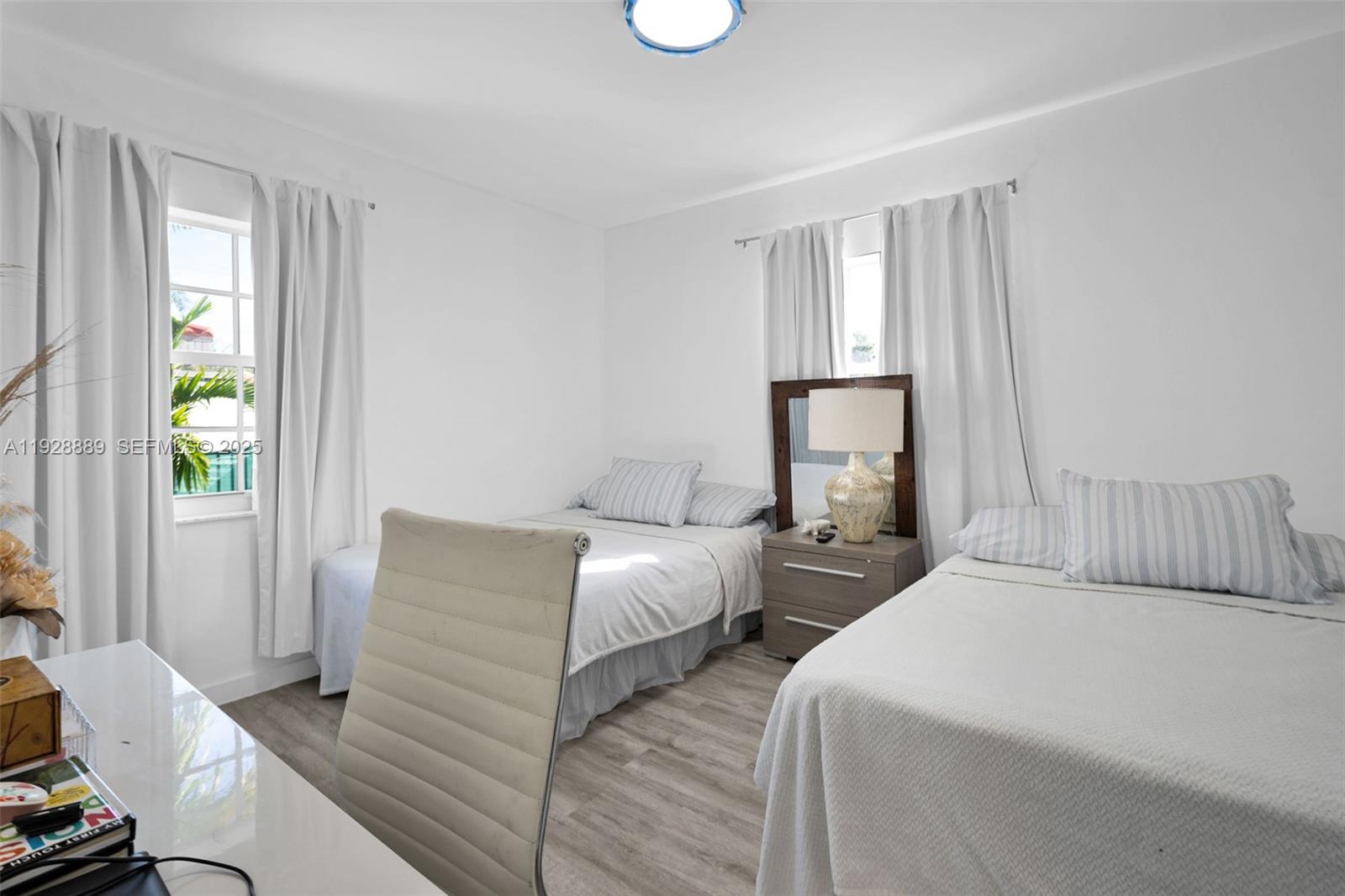 3711 Southwest 27th Terrace Miami, FL 33134 - Photo 27 of 62 a bedroom with two beds and a window