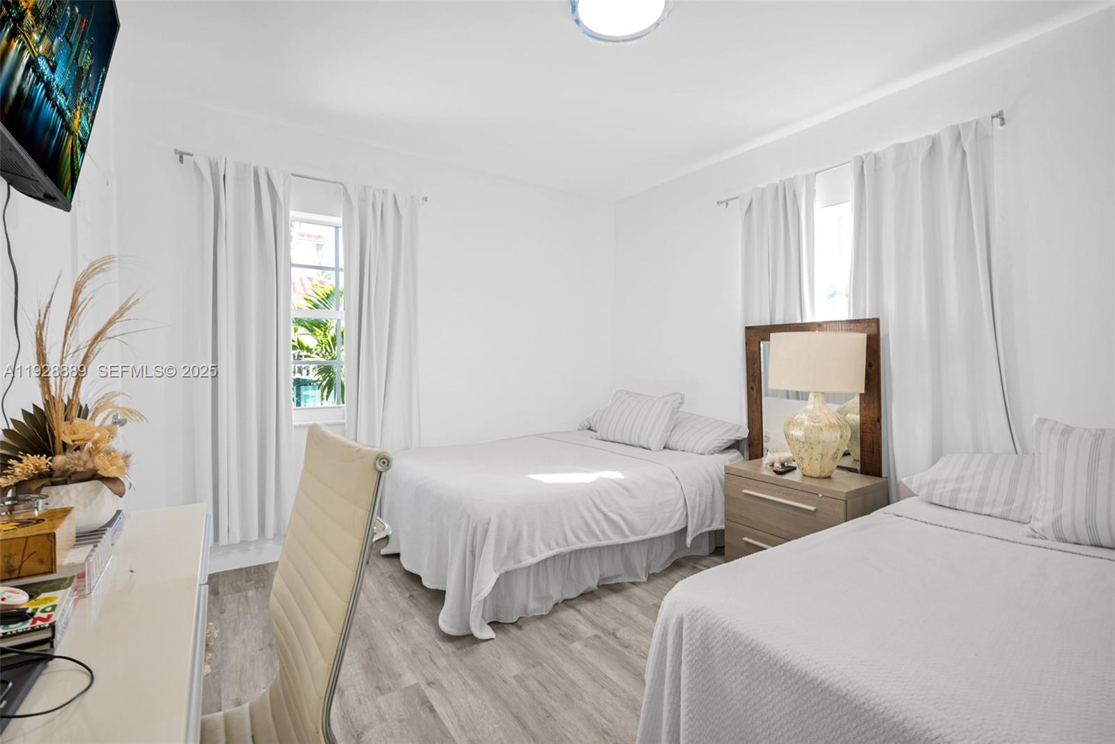 3711 Southwest 27th Terrace Miami, FL 33134 - Photo 28 of 62 a bedroom with two beds and a potted plant