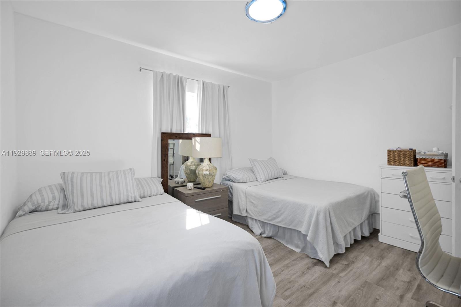 3711 Southwest 27th Terrace Miami, FL 33134 - Photo 29 of 62 a bedroom with two beds and a window