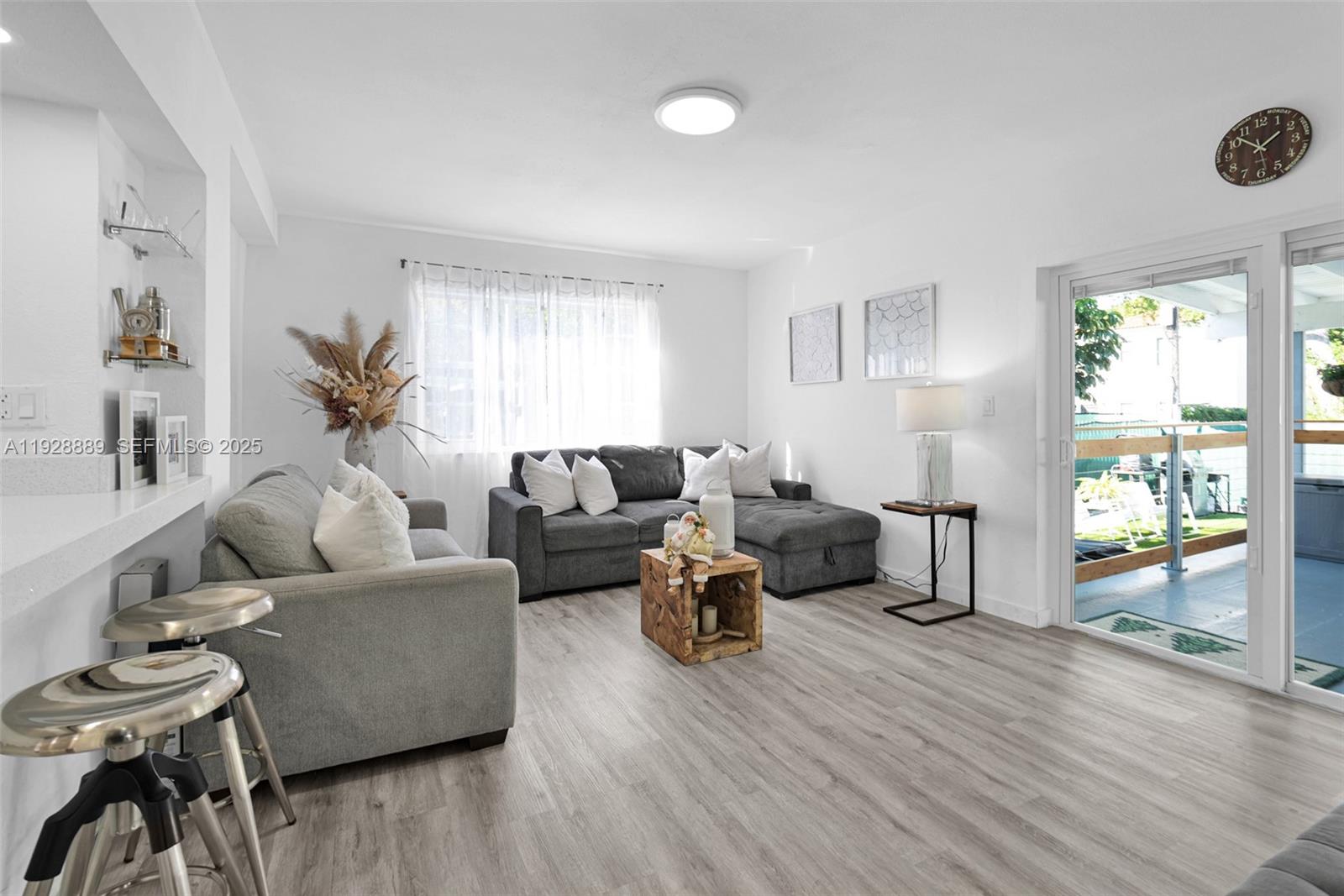 3711 Southwest 27th Terrace Miami, FL 33134 - Photo 31 of 62 a living room with furniture and a wooden floor