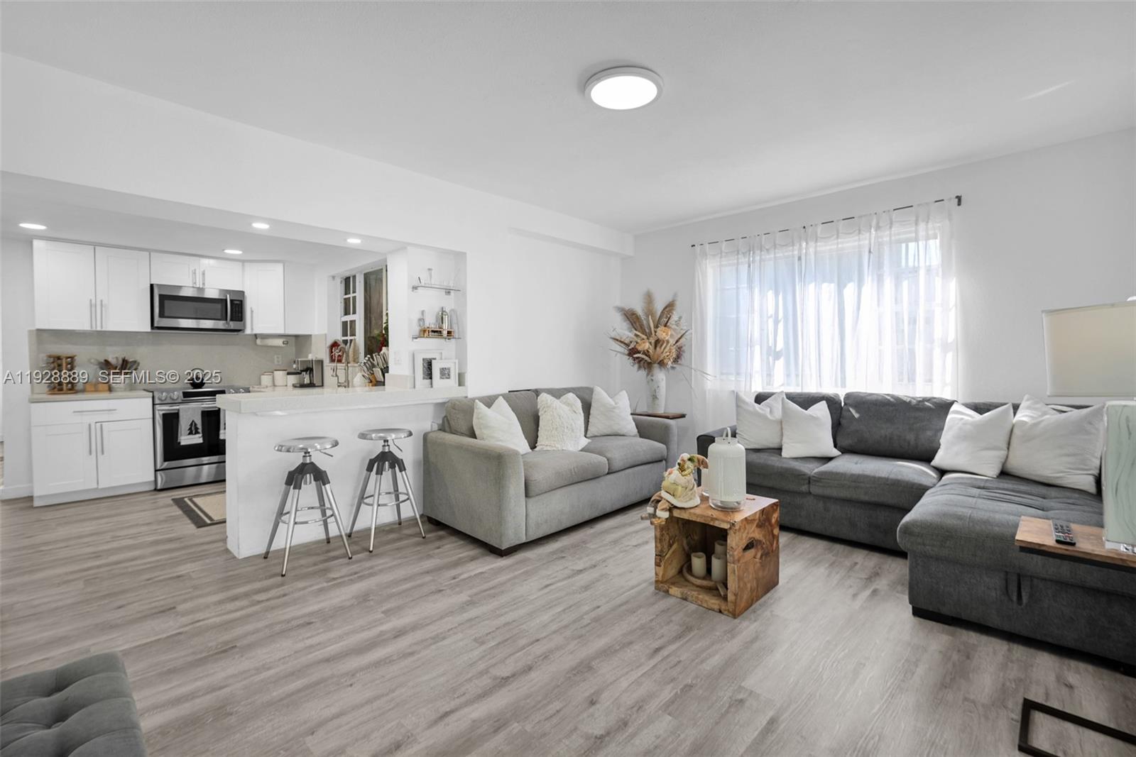 3711 Southwest 27th Terrace Miami, FL 33134 - Photo 32 of 62 a living room with furniture and a wooden floor