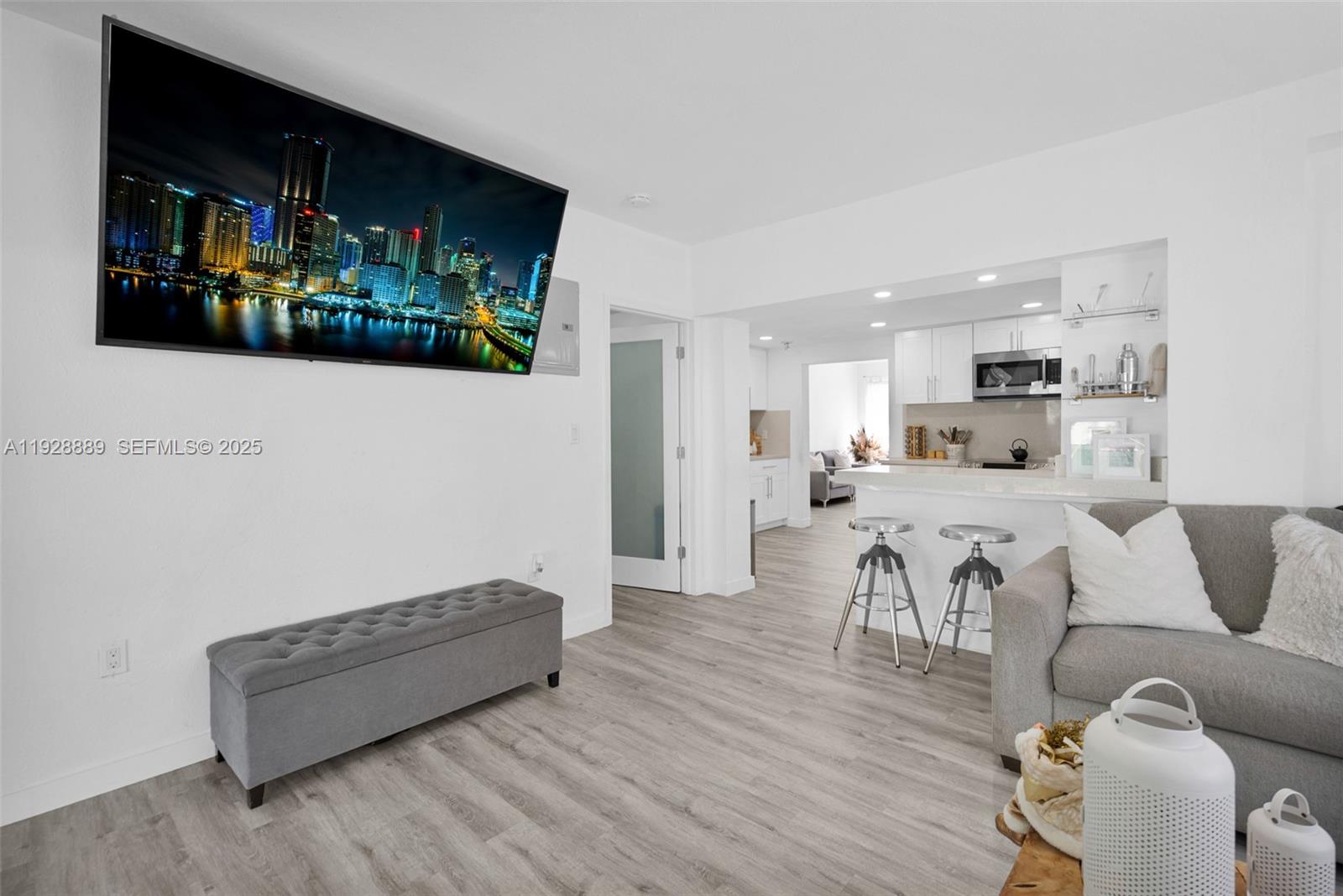 3711 Southwest 27th Terrace Miami, FL 33134 - Photo 33 of 62 a living room with furniture and a wooden floor