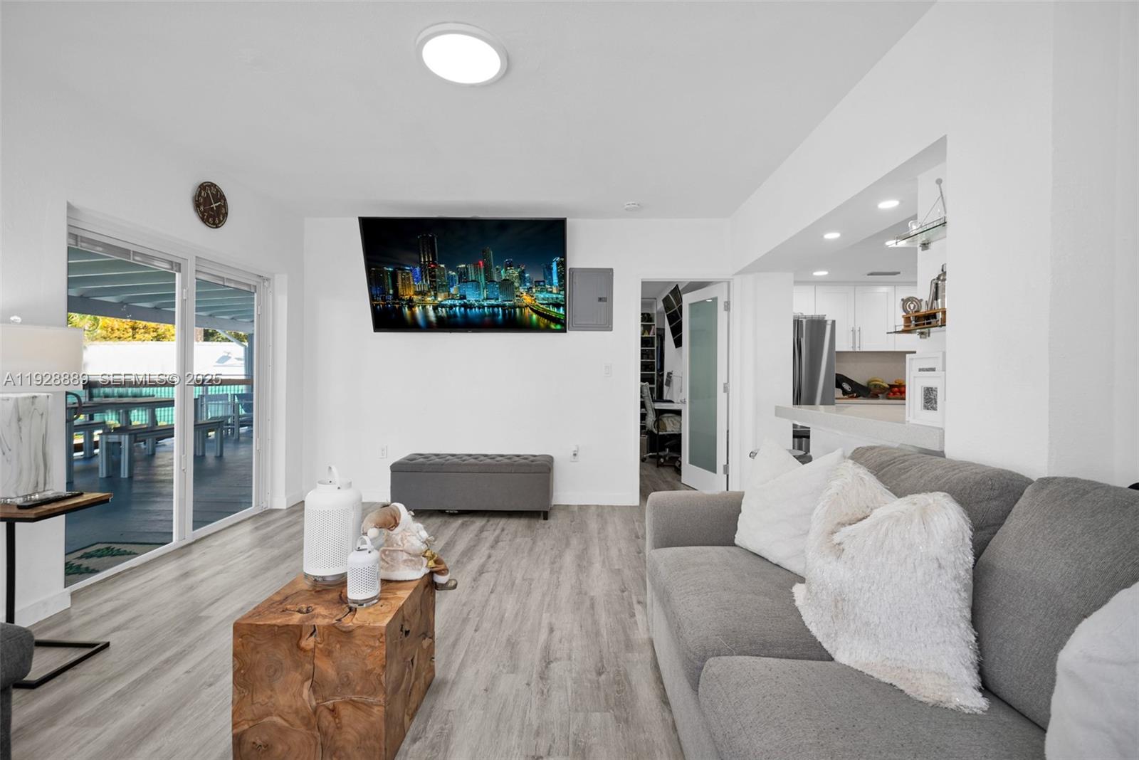 3711 Southwest 27th Terrace Miami, FL 33134 - Photo 34 of 62 a living room with furniture and a flat screen tv