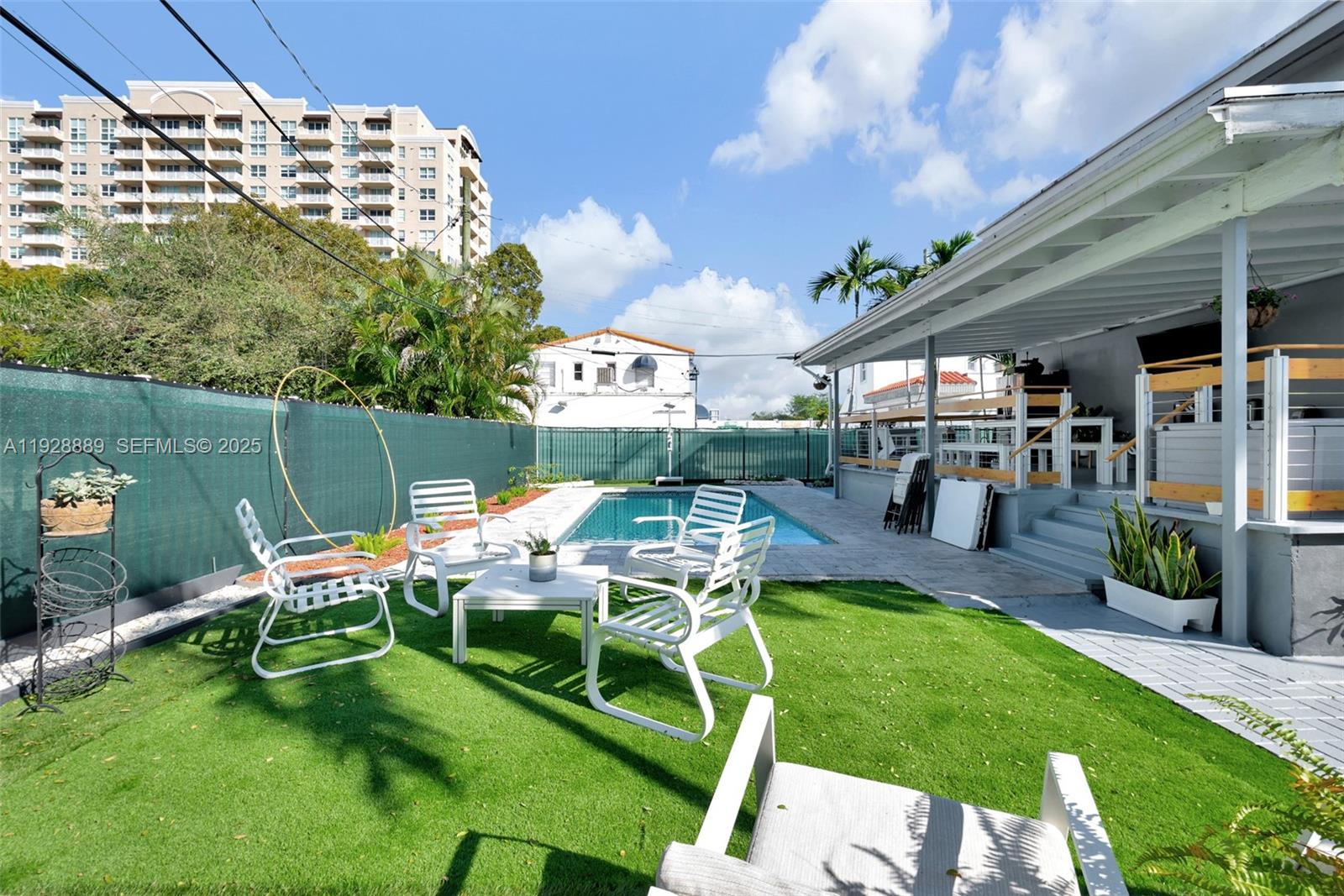 3711 Southwest 27th Terrace Miami, FL 33134 - Photo 41 of 62 a view of a chairs and table in backyard of the house