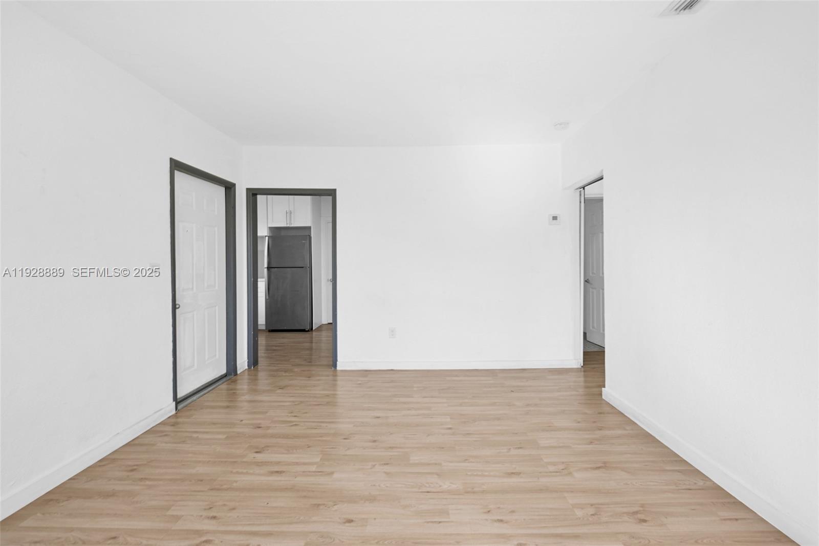 3711 Southwest 27th Terrace Miami, FL 33134 - Photo 48 of 62 a view of an empty room with wooden floor