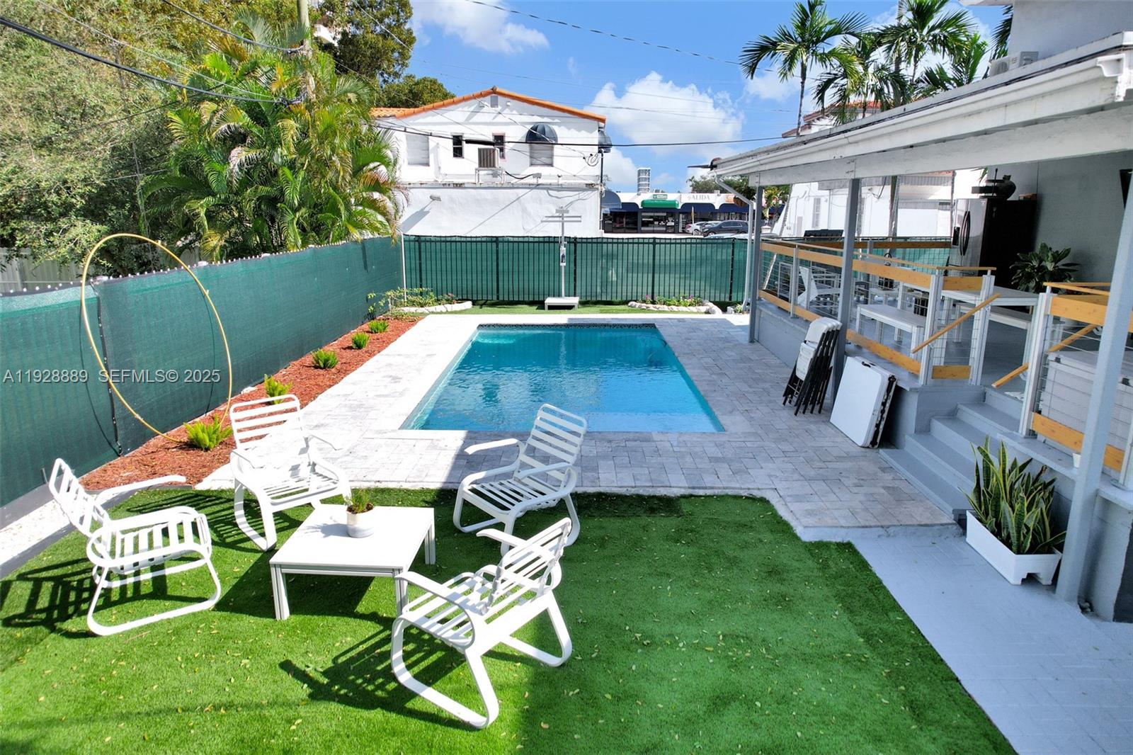 3711 Southwest 27th Terrace Miami, FL 33134 - Photo 6 of 62 a view of a chairs and table in backyard