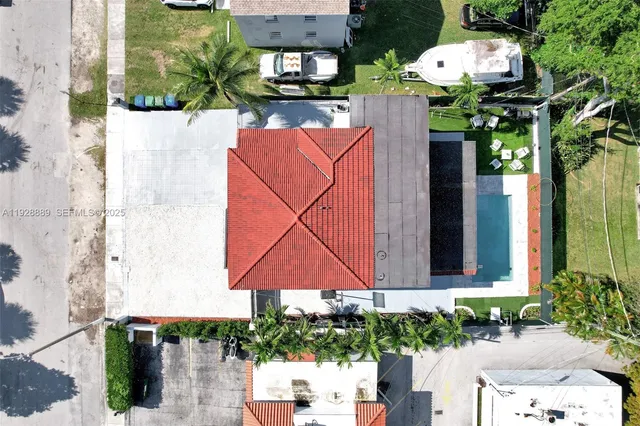 a view of a patio with table and chairs with wooden floor and fence