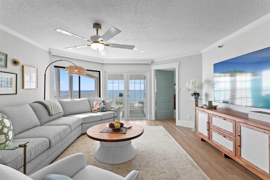 16332 Gulf Boulevard, Unit 3B Redington Beach, FL 33708 - Photo 4 of 91 a living room with furniture and a large window