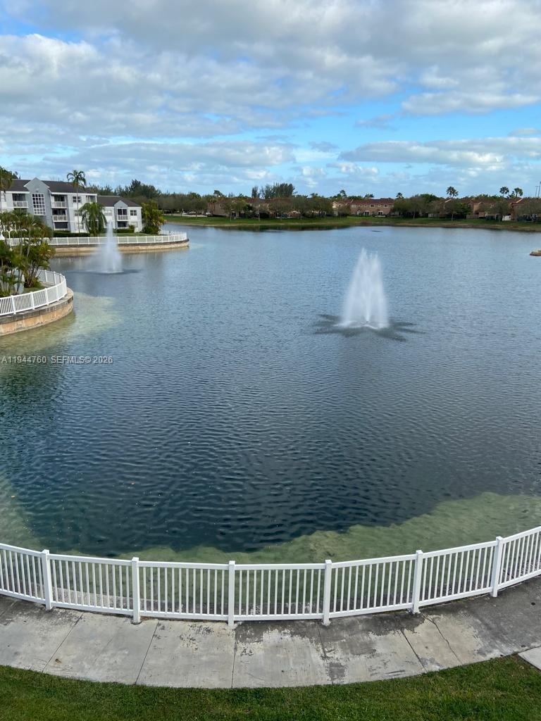 8640 Southwest 212th Street, Unit 304 Cutler Bay, FL 33189 - Photo 13 of 26 a view of a lake from a yard