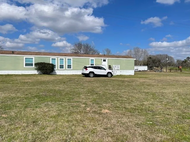 a view of car parked in front of a building