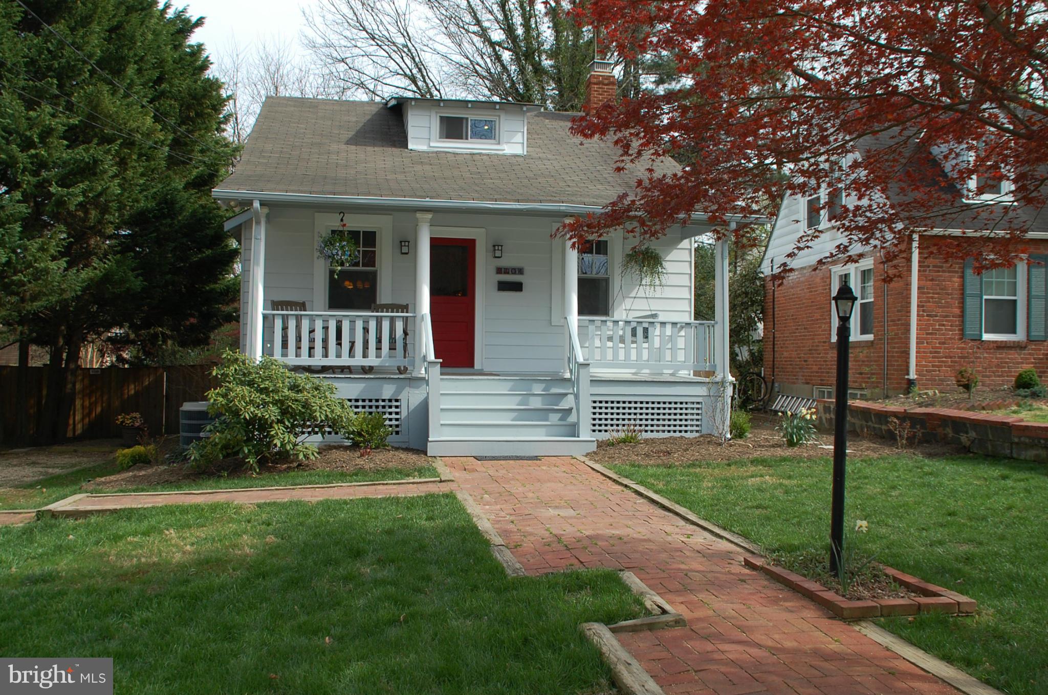 2104 Hanover Street Silver Spring, MD 20910 - Photo 1 of 22 a front view of a house with a yard and porch