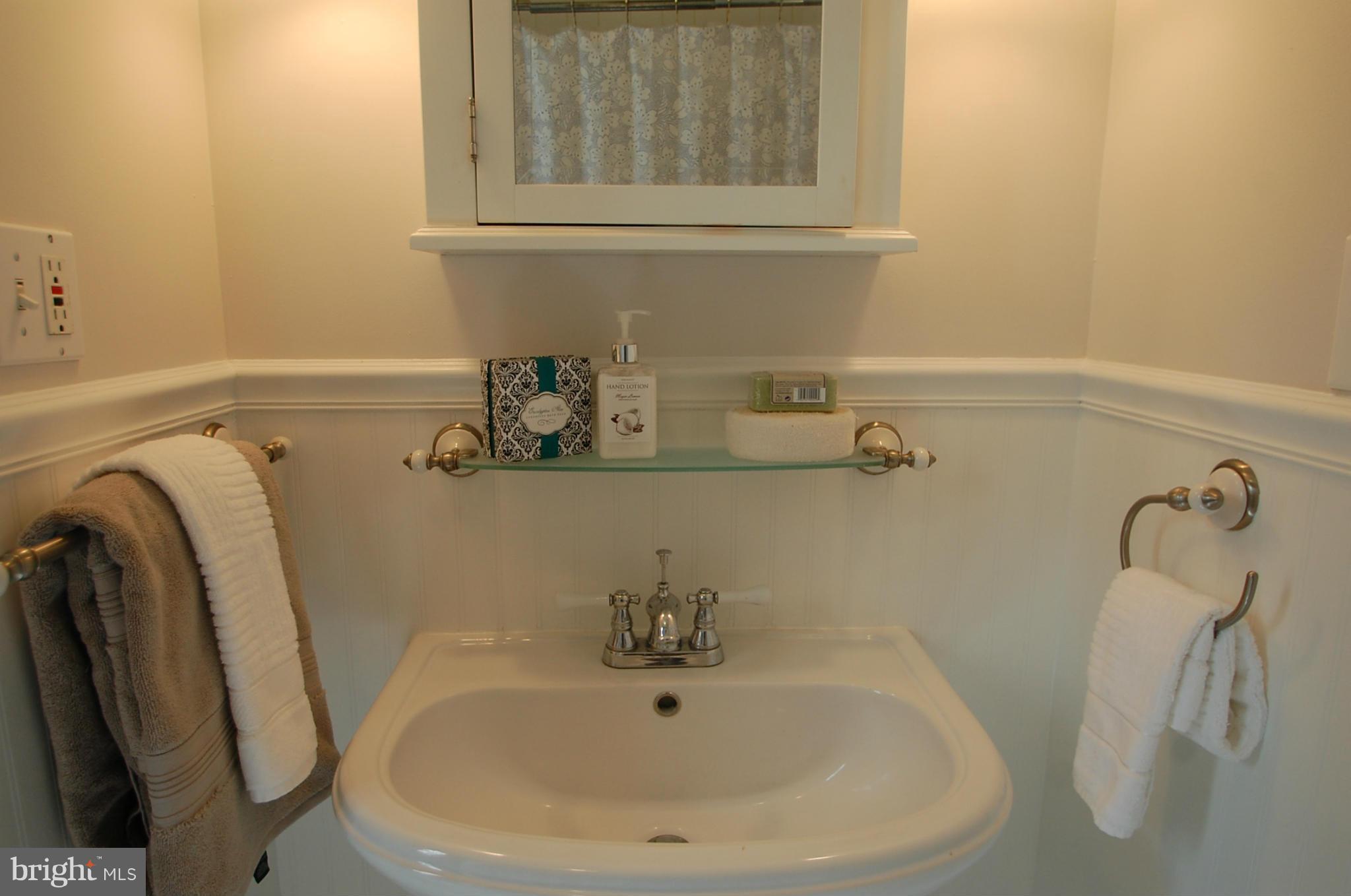 2104 Hanover Street Silver Spring, MD 20910 - Photo 14 of 22 a bathroom with a sink and a mirror