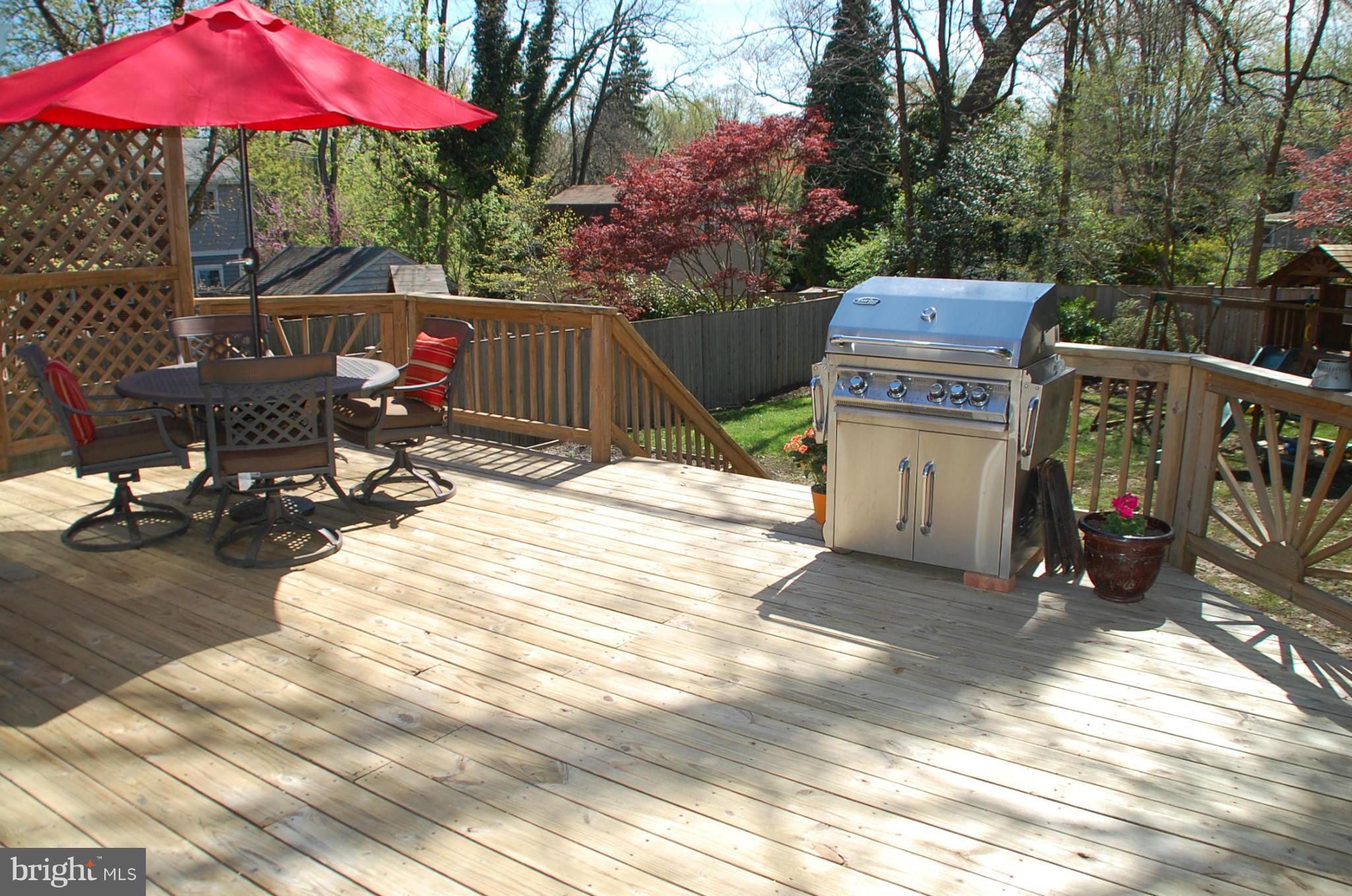 2104 Hanover Street Silver Spring, MD 20910 - Photo 16 of 22 a view of a patio with table and chairs under an umbrella