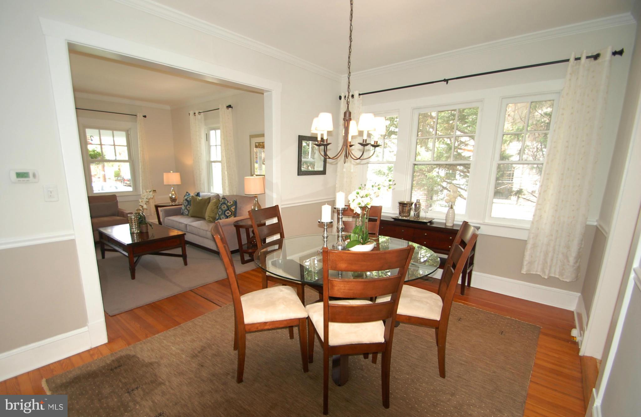 2104 Hanover Street Silver Spring, MD 20910 - Photo 6 of 22 a view of a dining room with furniture and chandelier