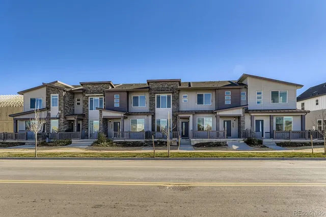 a front view of a building with large windows
