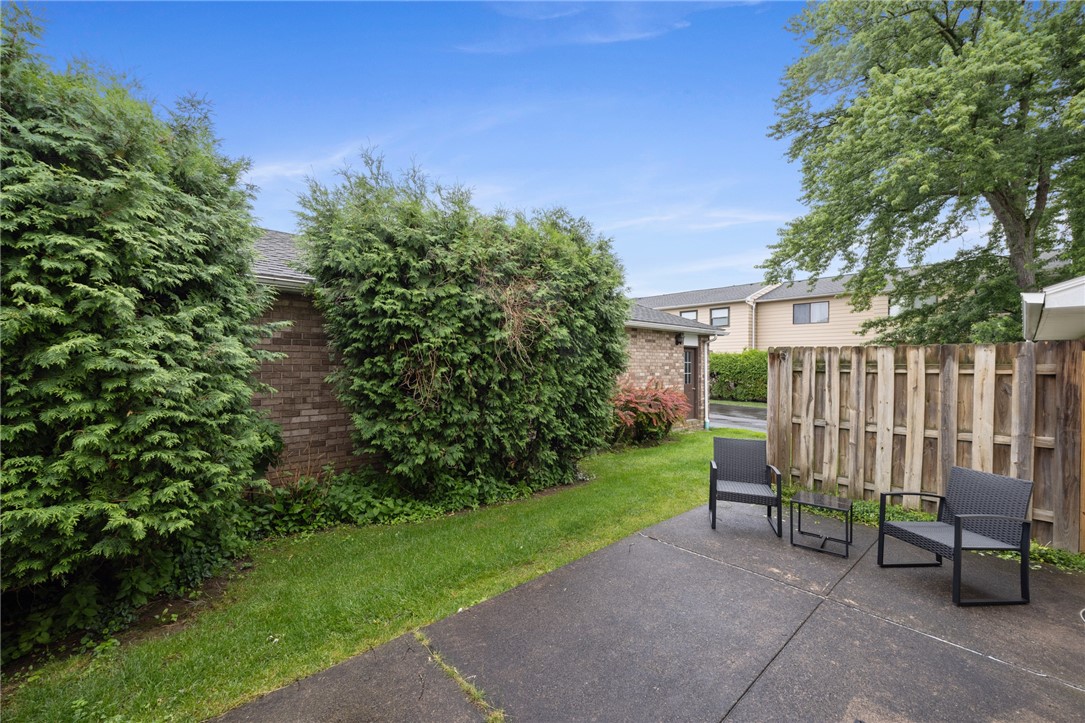 597 French Road Brighton, NY 14618 - Photo 22 of 24 Back yard patio area is incredibly private.