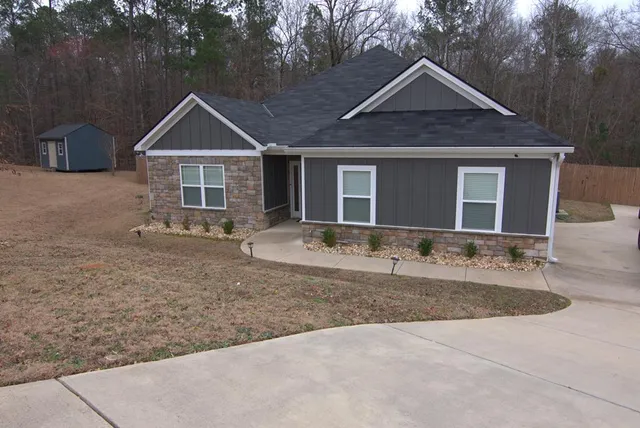 a front view of a house with yard